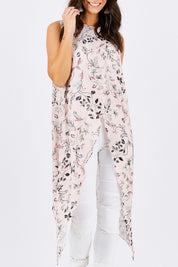 Model Georgia wearing size 10 of the Flying Free Top in colour PinkFleur (Pink), from the front, cropped image