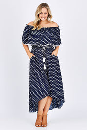 Model Jess wearing size 14 of the Florence Maxi Dress in colour NavySpot (Blue), from the front, showing the whole outfit