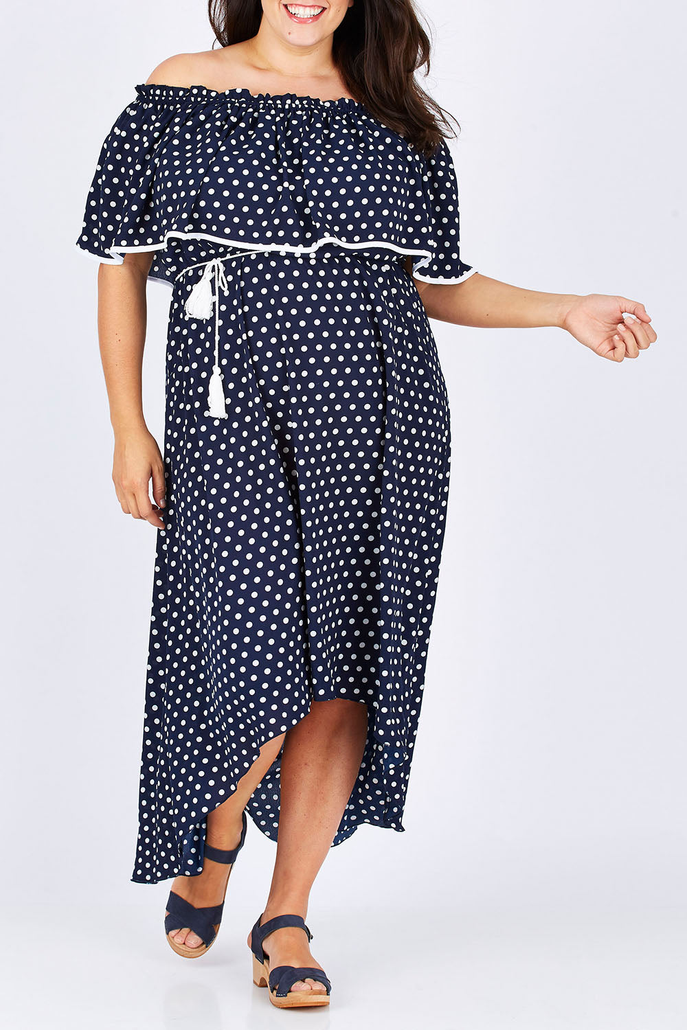 Model Mae wearing size 18 of the Florence Maxi Dress in colour NavySpot (Blue), from the front, cropped image