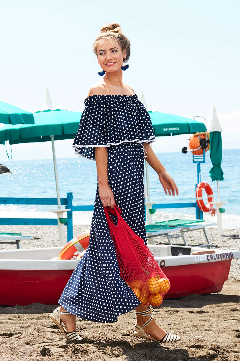 Model Marnee wearing size 10 of the Florence Maxi Dress in colour NavySpot (Blue), from the front, showing the whole outfit