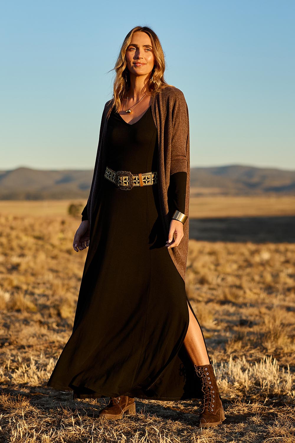 Model Tegan wearing size 10 of the My Faithful Maxi Tee Dress in colour Black (Black), from the front, showing the whole outfit