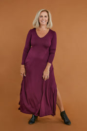 Model Sandy wearing size 10 of the My Faithful Maxi Tee Dress in colour Scarlet (Red), from the front, showing the whole outfit