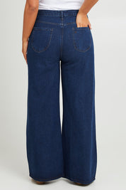 Model Monique wearing size 14 of the Happy Me Wide Leg Jeans in colour Darkdenim (Blue), from the back