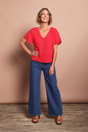 Model Riina wearing size 10 of the Happy Me Wide Leg Jeans in colour Darkdenim (Blue), from the front, showing the whole outfit