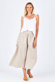 Model Anna wearing size 10 of the Easy Daze Wide Cotton Linen Pants in colour Sand, from the front, showing the whole outfit