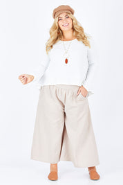Model Sophie wearing size 18 of the Easy Daze Wide Cotton Linen Pants in colour Sand, from the front, showing the whole outfit
