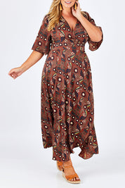Model Fiona wearing size 16 of the Maximum Impact Dress in colour Rust, from the front, cropped image