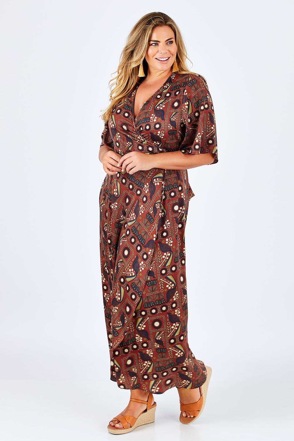 Model Fiona wearing size 16 of the Maximum Impact Dress in colour Rust, from the front, showing the whole outfit