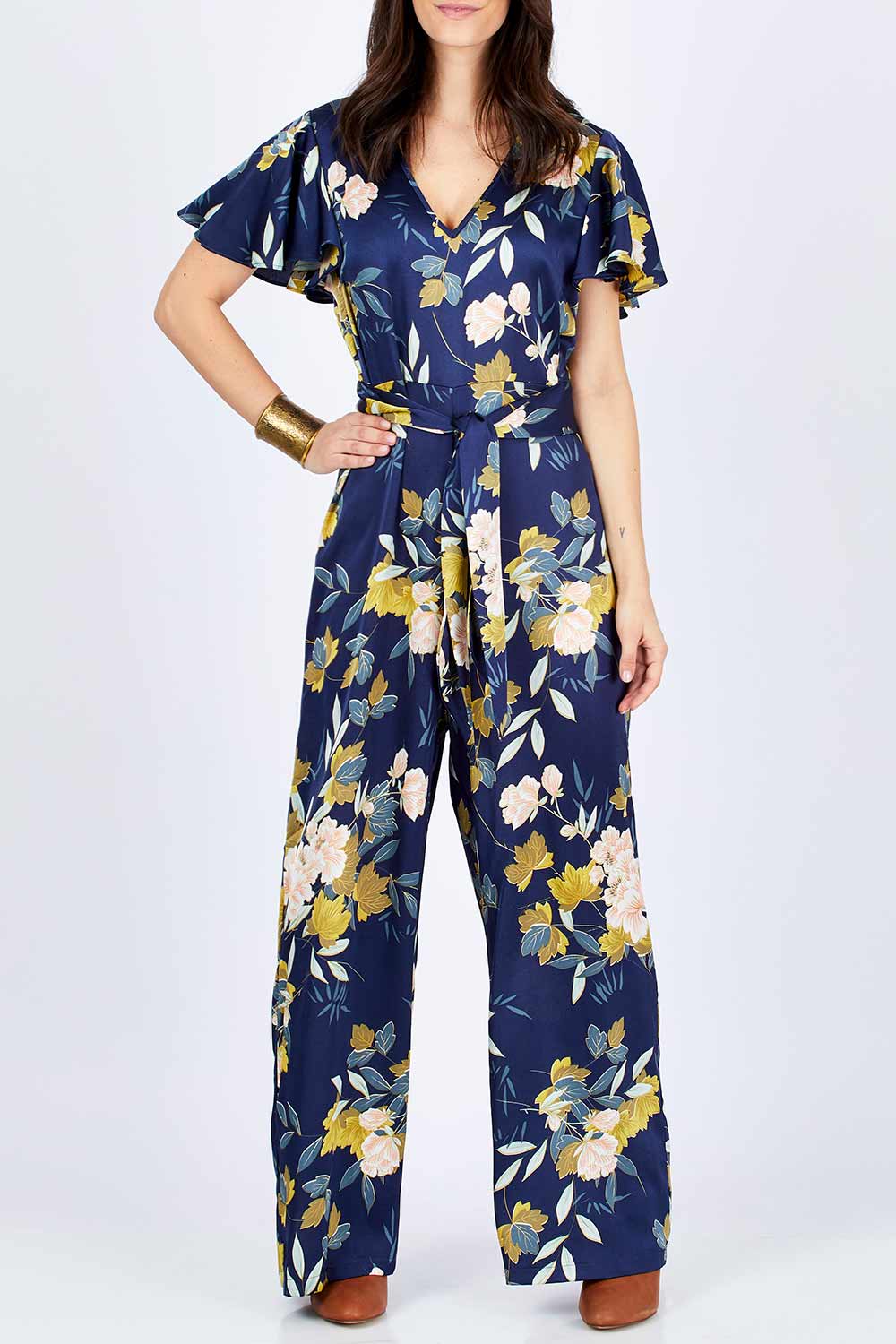 Model Georgia wearing size 10 of the Sunday Picnic Jumpsuit in colour NavyFluer (Blue), from the front, cropped image