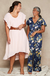 Model Nadine wearing size 10 of the Sunday Picnic Jumpsuit in colour NavyFluer (Blue), from the front, showing the whole outfit