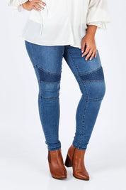 Model Fiona wearing size 16 of the Wild One Stitched Jeggings in colour Denim (Blue), from the front, cropped image