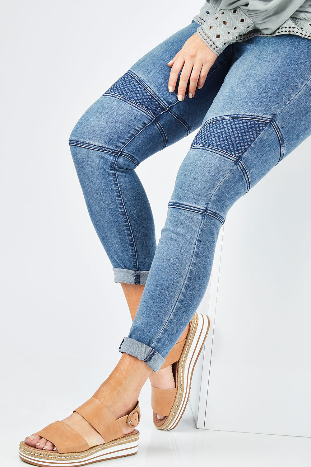 Model Laura wearing size 14 of the Wild One Stitched Jeggings in colour Denim (Blue), from the front, cropped image