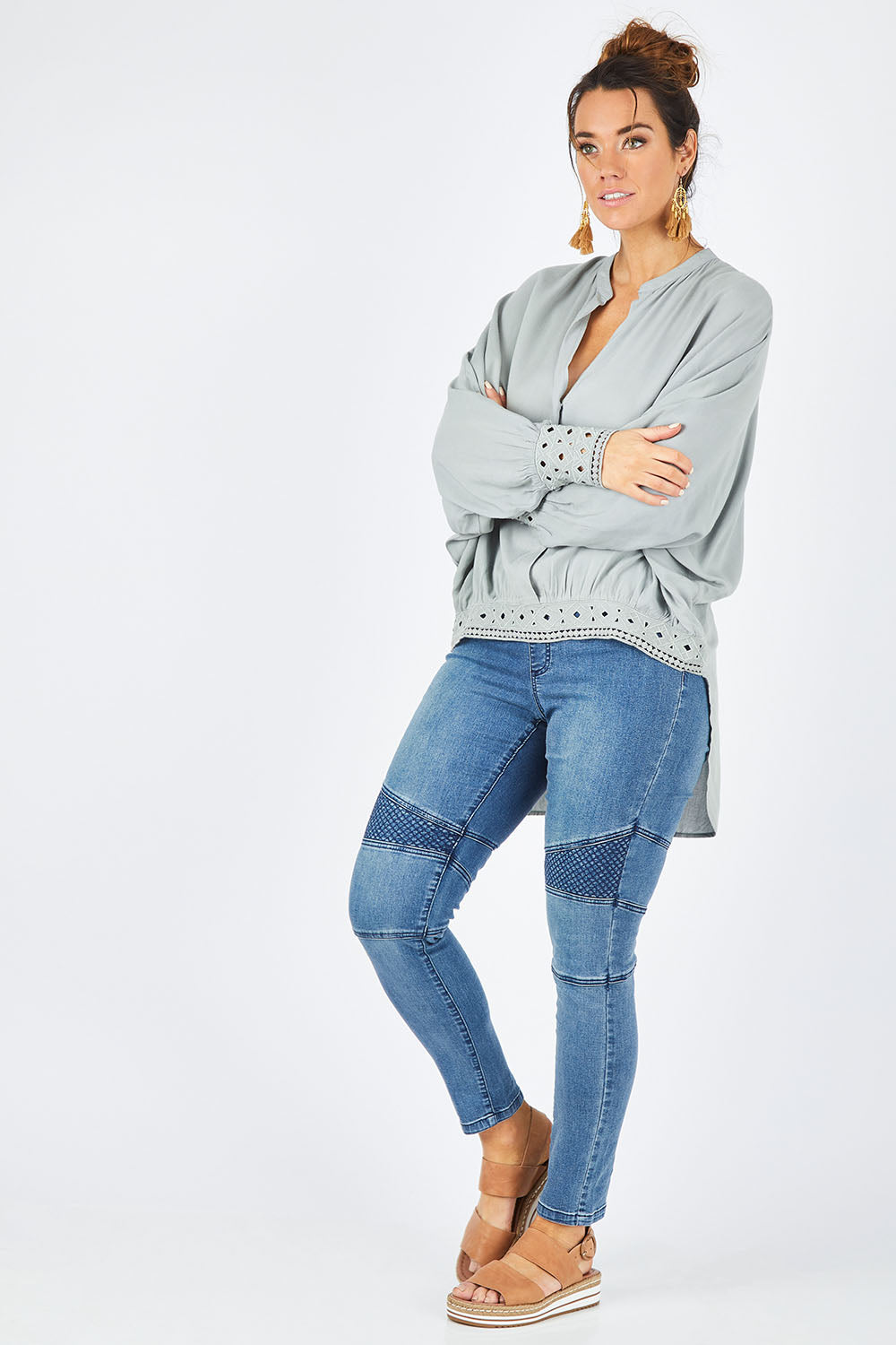 Model Laura wearing size 14 of the Wild One Stitched Jeggings in colour Denim (Blue), from the front, showing the whole outfit