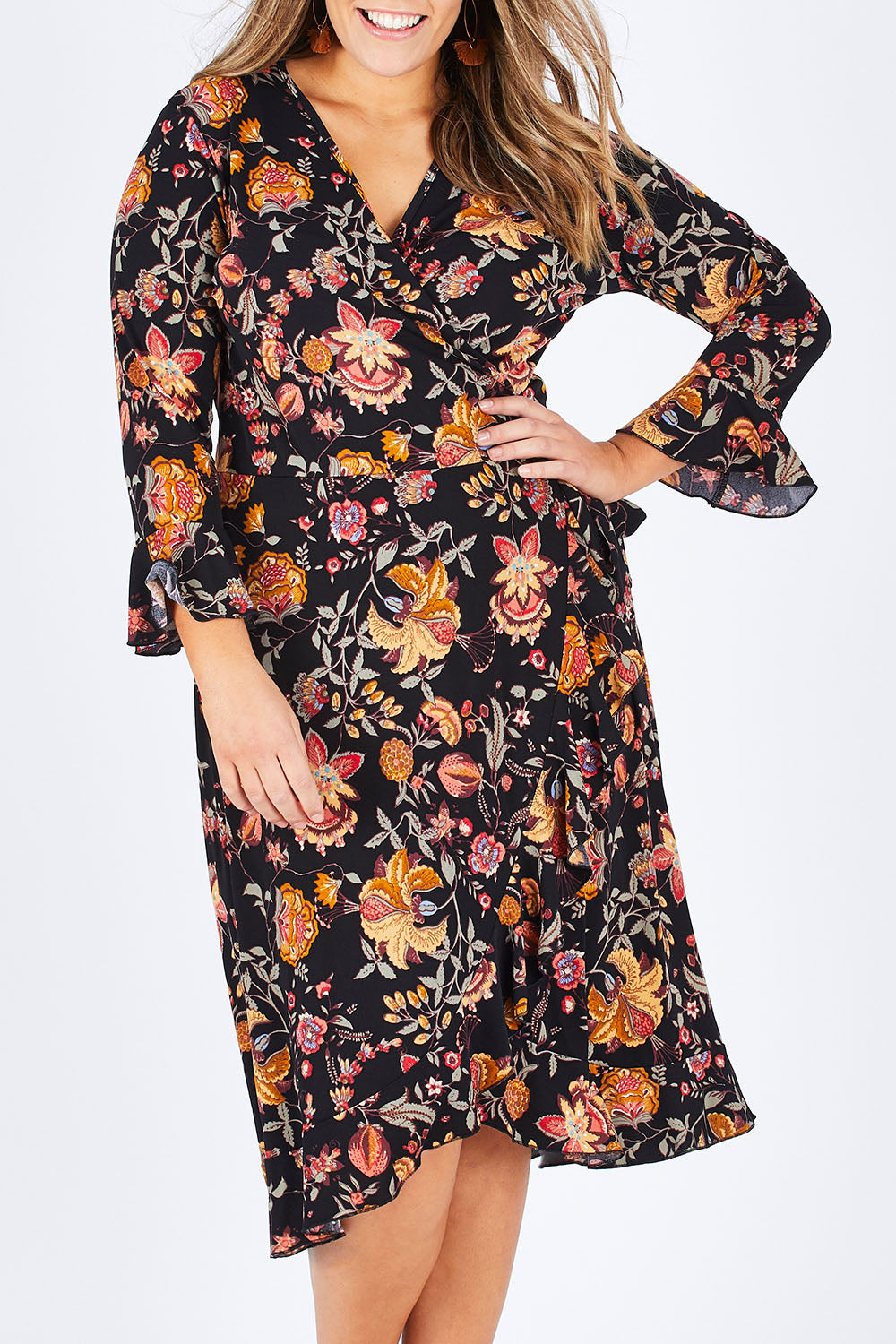 Model Natalia wearing size 14 of the Swanning Around Wrap Dress in colour BlackOrch (Black), from the front, cropped image