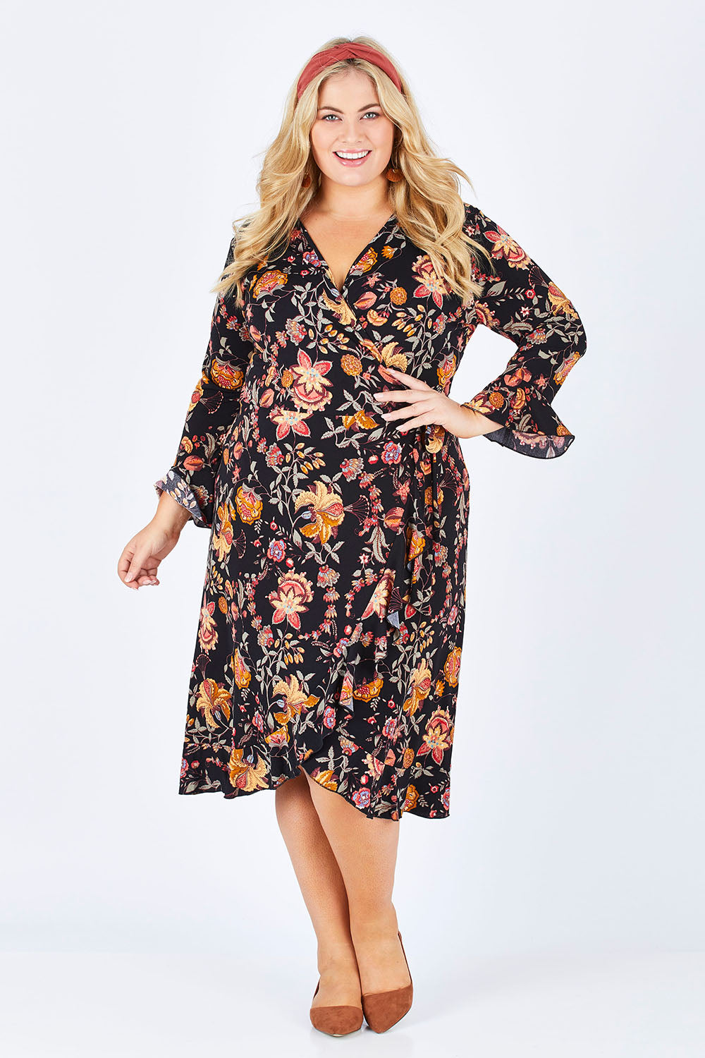 Model Sophie wearing size 18 of the Swanning Around Wrap Dress in colour BlackOrch (Black), from the front, showing the whole outfit