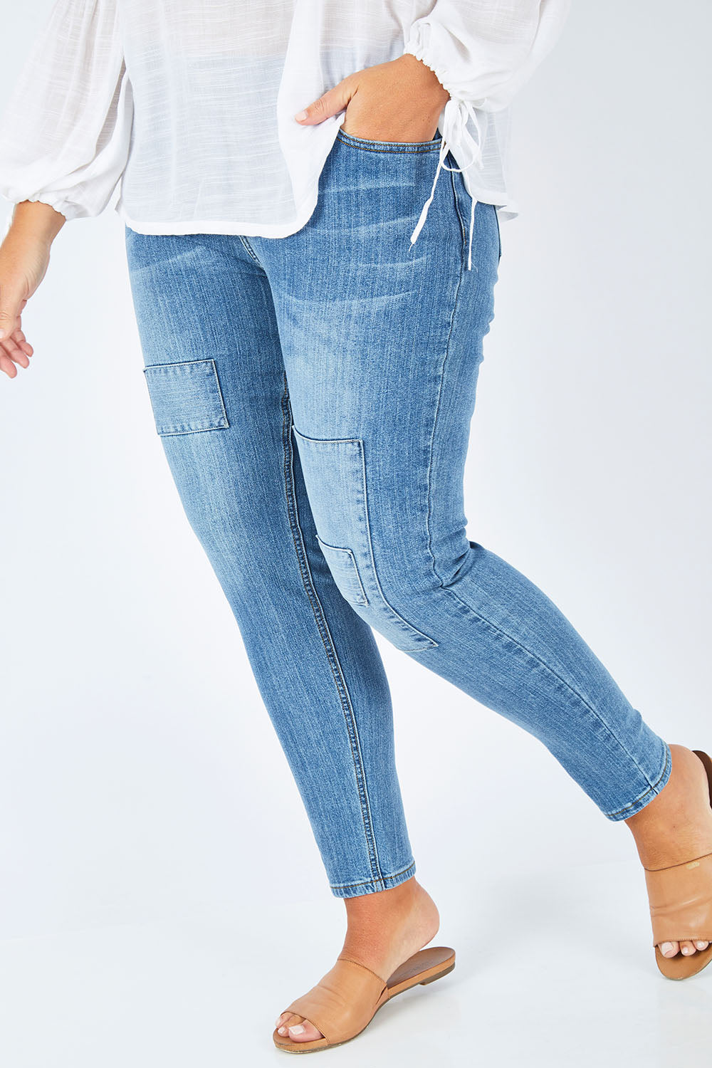 Model Fiona wearing size 16 of the You Patched Me All Up Jeans in colour PaleDenim (Blue), from the front, cropped image