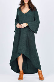 Model Georgia wearing size 10 of the Cloud Kissed Dress in colour Forest (Green), from the front, cropped image