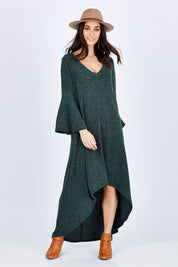 Model Georgia wearing size 10 of the Cloud Kissed Dress in colour Forest (Green), from the front, showing the whole outfit