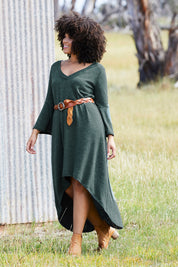Model Rosaline wearing size 14 of the Cloud Kissed Dress in colour Forest (Green), from the front, showing the whole outfit
