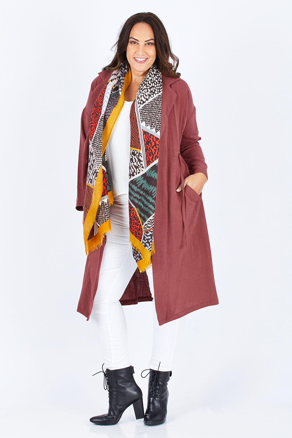 Model Stacey wearing size 12 of the Got You Covered Jacket in colour Wine (Red), from the front, showing the whole outfit