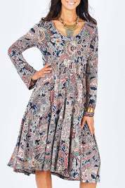 Model Gemma wearing size 10 of the Wind In My Hair Dress in colour Paisley (Red), from the front, cropped image
