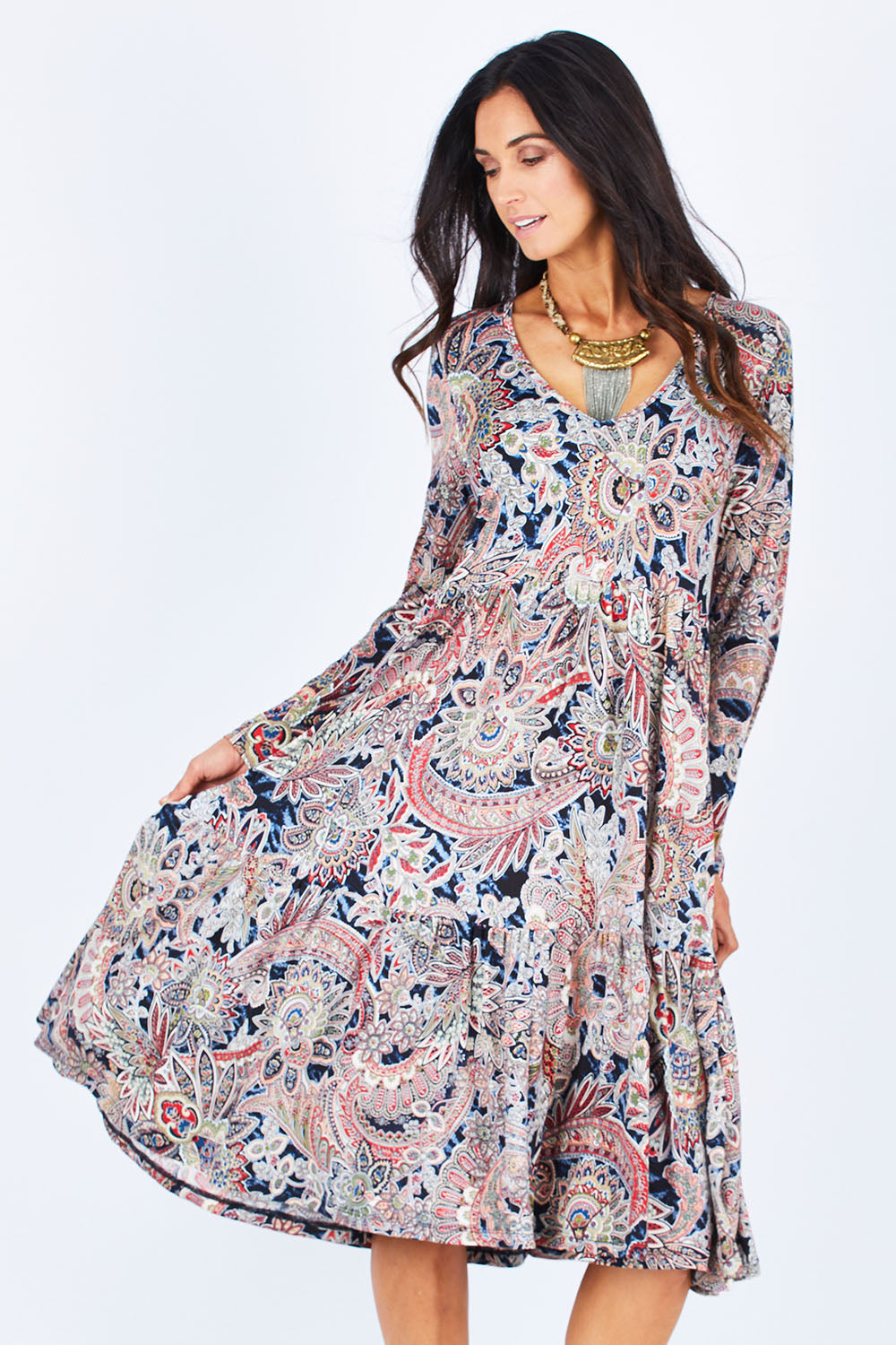 Model Gemma wearing size 10 of the Wind In My Hair Dress in colour Paisley (Red), from the front, cropped image