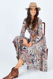 Model Gemma wearing size 10 of the Wind In My Hair Dress in colour Paisley (Red), from the front, showing the whole outfit