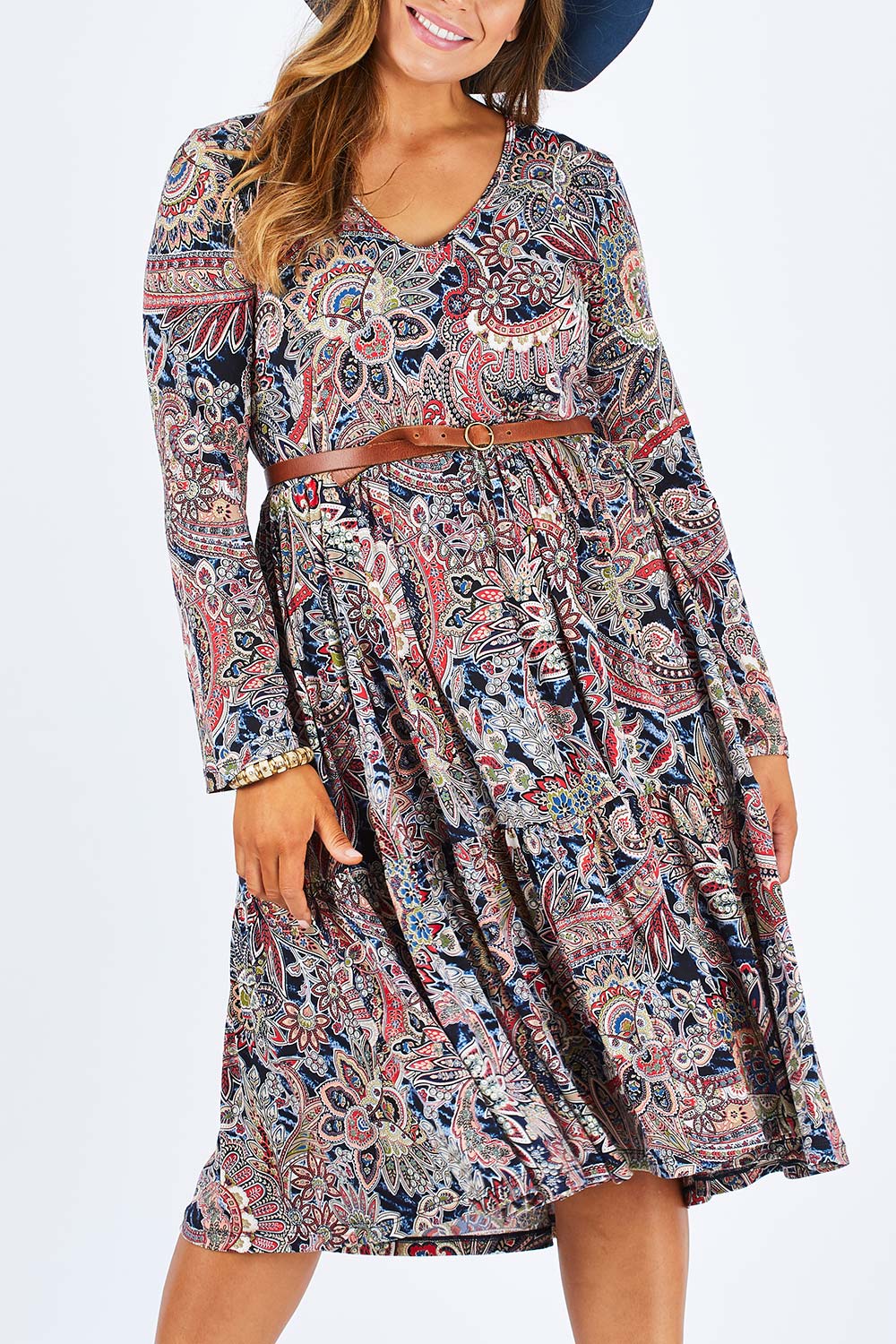 Model Palatina wearing size 14 of the Wind In My Hair Dress in colour Paisley (Red), from the front, cropped image