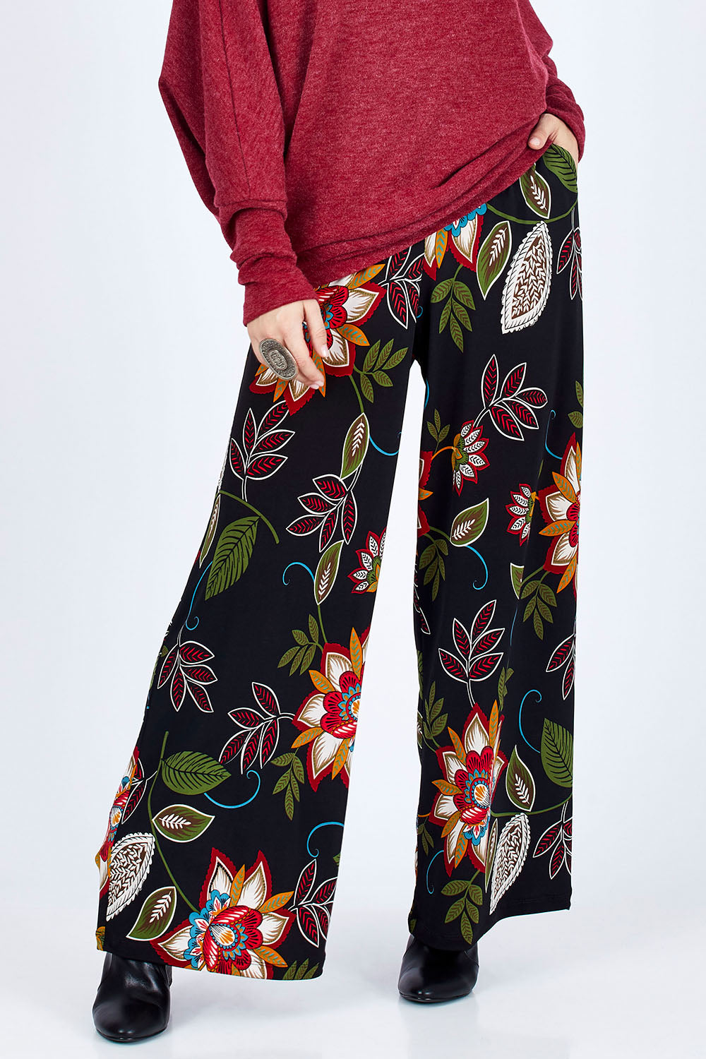 Model Georgia wearing size 10 of the Falling Leaves Wide Leg Pant in colour Black (Black), from the front, cropped image