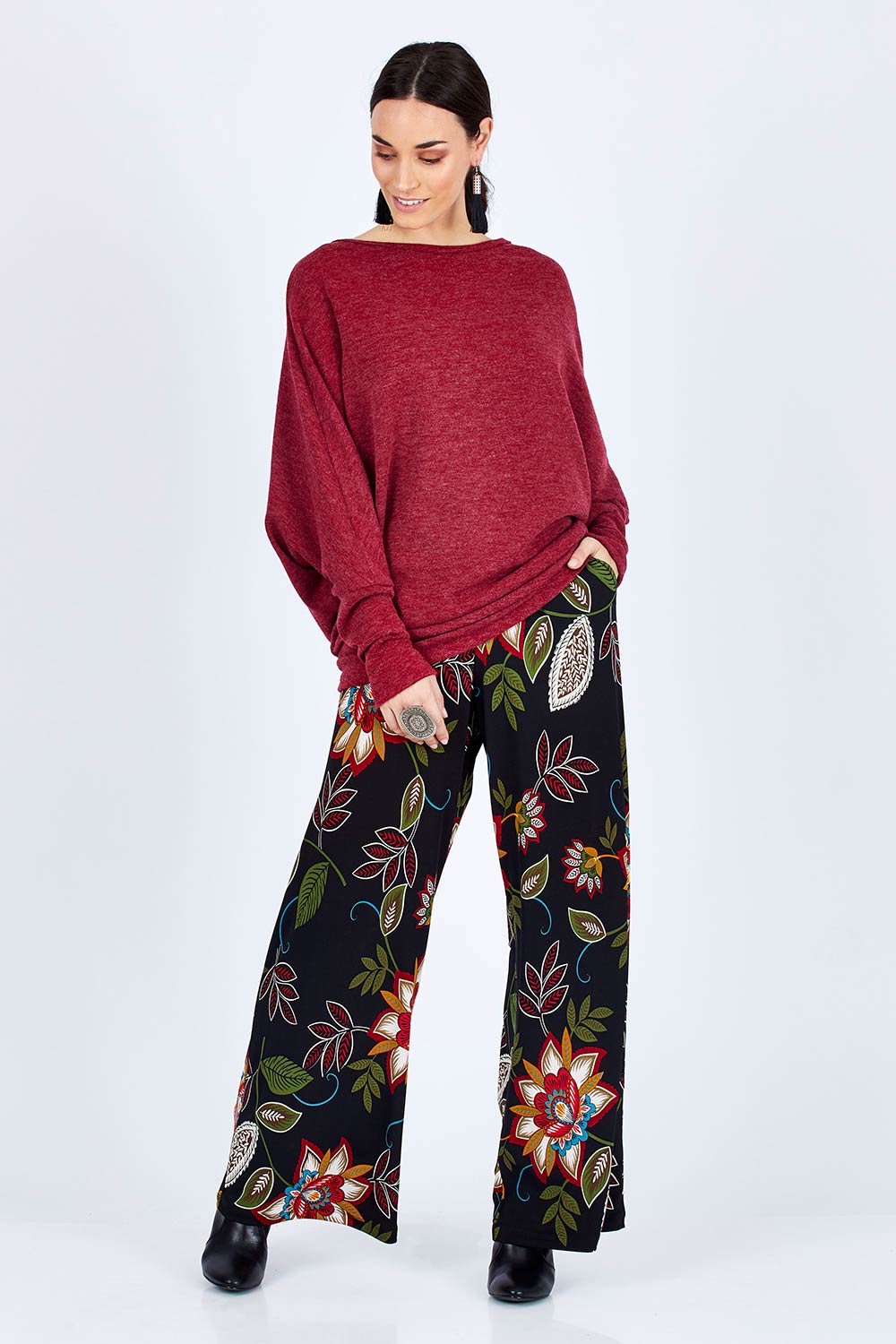 Model Georgia wearing size 10 of the Falling Leaves Wide Leg Pant in colour Black (Black), from the front, showing the whole outfit