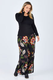 Model Jess wearing size 14 of the Falling Leaves Wide Leg Pant in colour Black (Black), from the front, showing the whole outfit