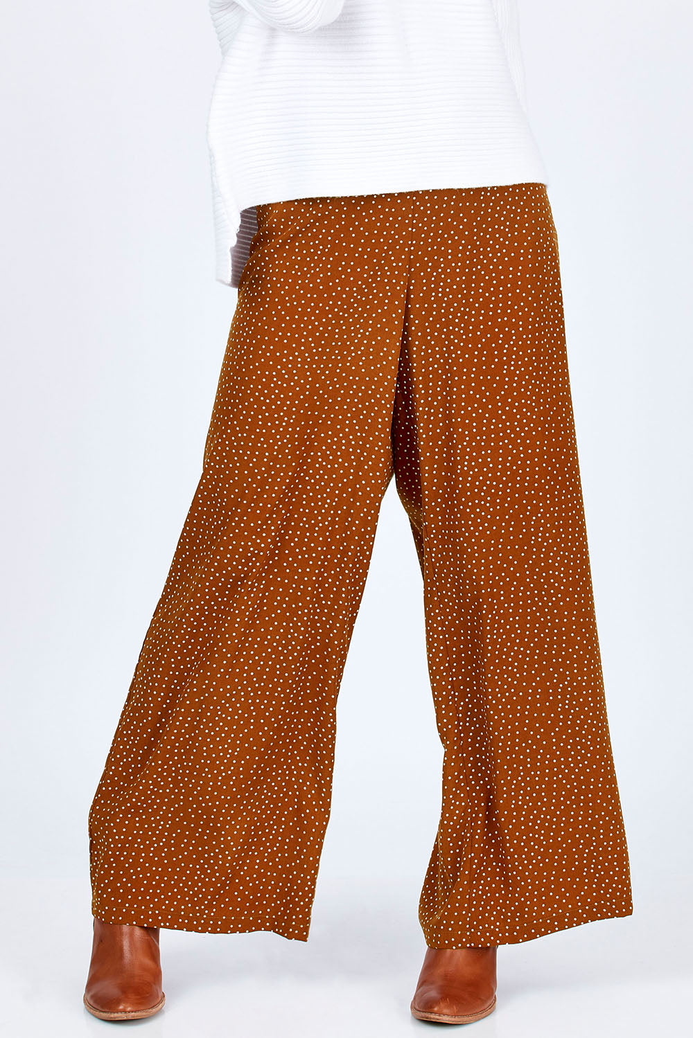 Model Georgia wearing size 10 of the Spotty About You Wide Leg Pants in colour Rust, from the front, cropped image