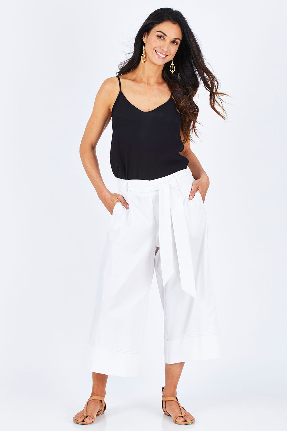 Model Gemma wearing size 10 of the Chasing Seagull Pants in colour White (White), from the front, showing the whole outfit