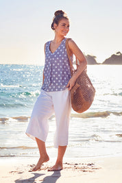 Model Marnee wearing size 10 of the Chasing Seagull Pants in colour White (White), from the front, showing the whole outfit