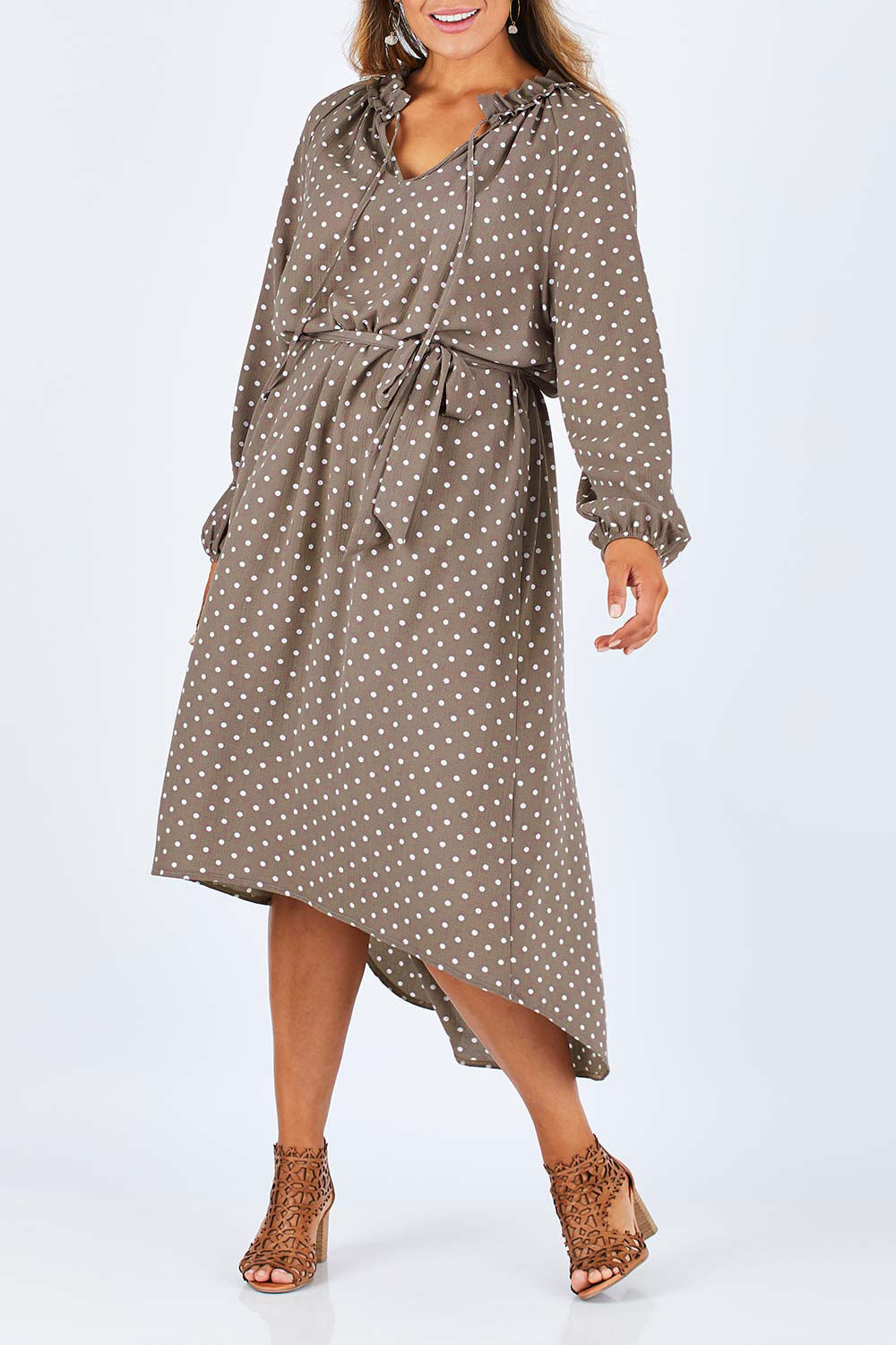 Model Palatina wearing size 14 of the Going With The Flow Dress in colour Taupe, from the front, cropped image