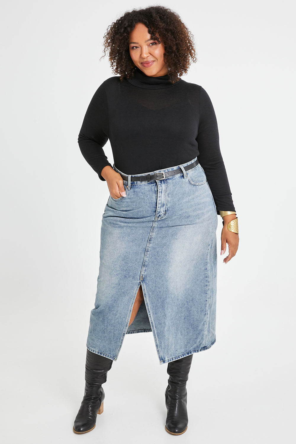Model Alexis wearing size 16 of the Happy Me Denim Skirt in colour Denim (Blue), from the front, showing the whole outfit