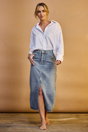 Model Tegan wearing size 10 of the Happy Me Denim Skirt in colour Denim (Blue), from the front, showing the whole outfit