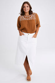 Model Monique wearing size 14 of the Happy Me Denim Skirt in colour White (White), from the front, showing the whole outfit
