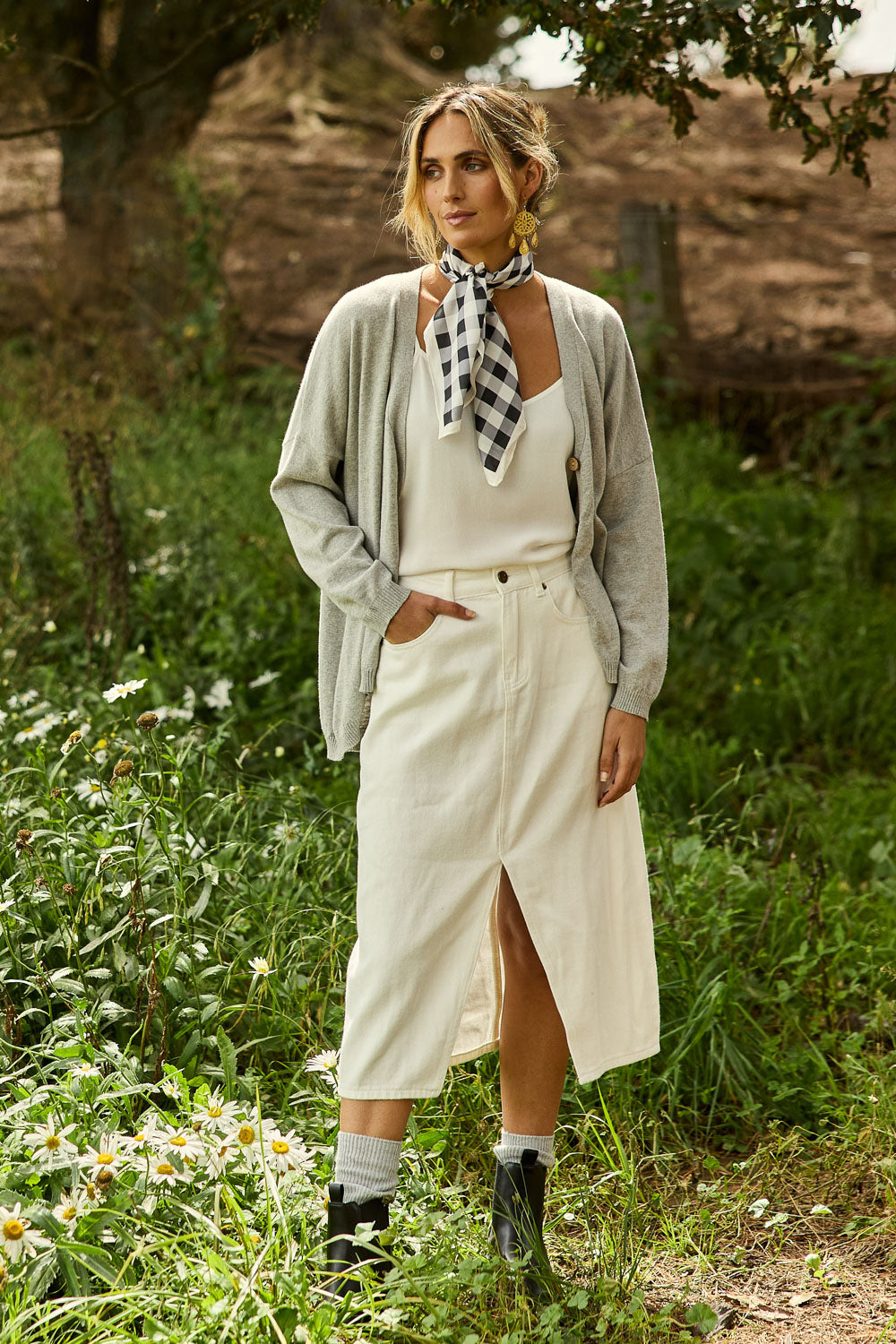 Model Tegan wearing size 10 of the Happy Me Denim Skirt in colour White (White), from the front, showing the whole outfit
