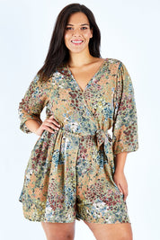 Model Lauren wearing size 18 of the Flower Safari Jumpsuit in colour Khaki (Green), from the front, cropped image