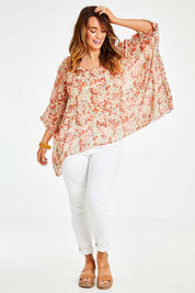 Model Laura wearing size 14 of the Easy Peasy Throw Top in colour Orangepop, from the front, showing the whole outfit