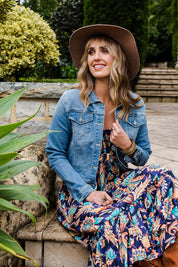 Model Tegan wearing size 10 of the Heartbeat Denim Jacket in colour Denim (Blue), from the front, showing the whole outfit