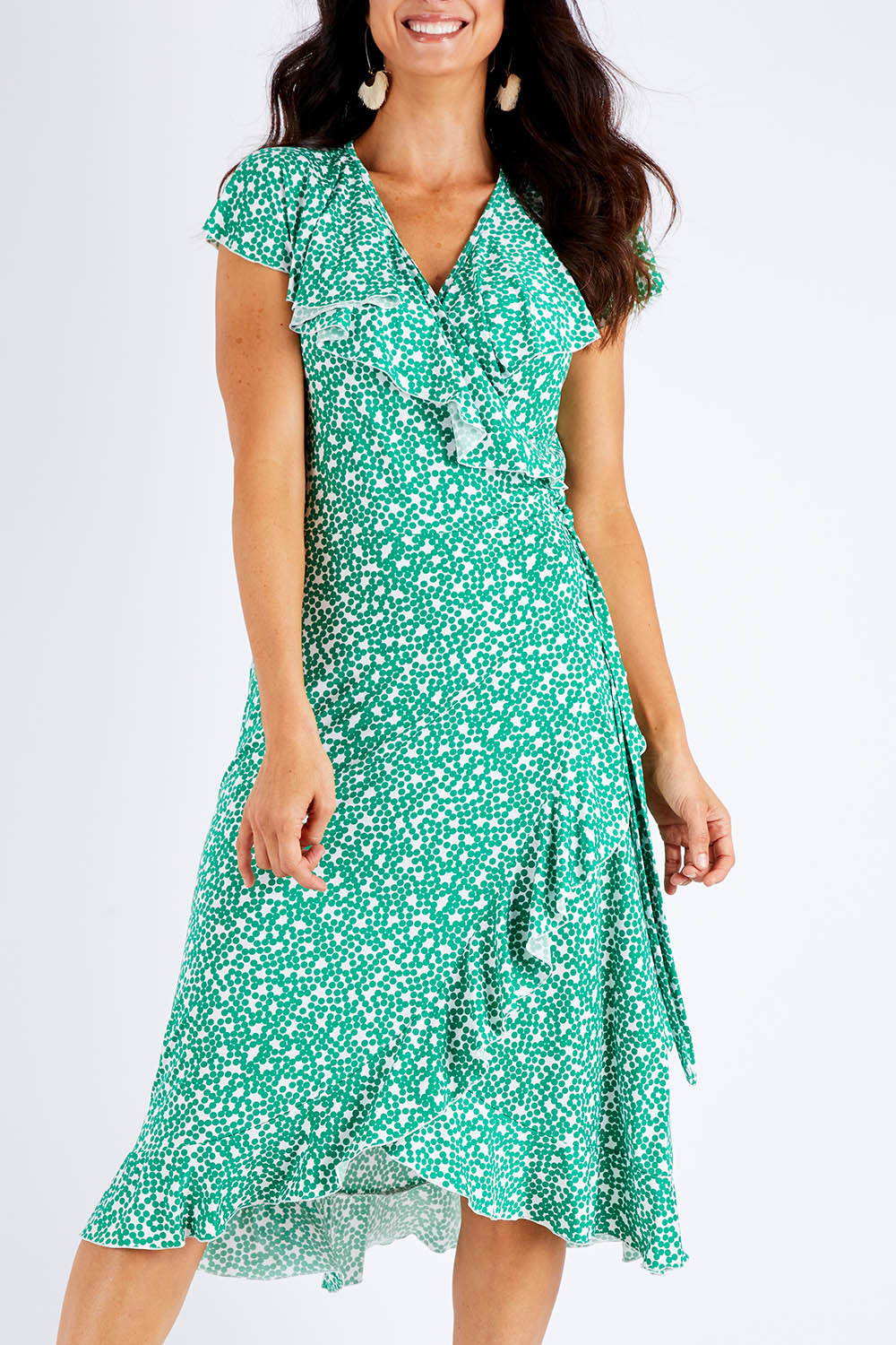 Model Gemma wearing size 10 of the Life Is Beautiful Wrap Dress in colour Greenspot (Green), from the front, cropped image
