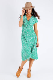 Model Gemma wearing size 10 of the Life Is Beautiful Wrap Dress in colour Greenspot (Green), from the front, showing the whole outfit