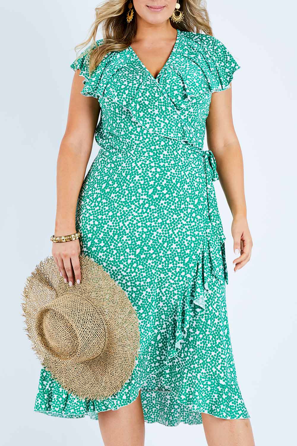 Model Jess wearing size 14 of the Life Is Beautiful Wrap Dress in colour Greenspot (Green), from the front, cropped image