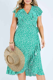 Model Jess wearing size 14 of the Life Is Beautiful Wrap Dress in colour Greenspot (Green), from the front, cropped image