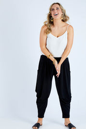 Model Jess wearing size 14 of The Wanderer In Me Travel Pant in colour Black (Black), from the front, showing the whole outfit