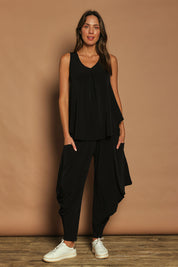 Model Madeline wearing size 10 of The Wanderer In Me Travel Pant in colour Black (Black), from the front, showing the whole outfit