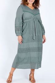Model Jess wearing size 16 of the Picnic In the Fields Dress in colour Stormy (Green), from the front, cropped image