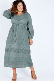 Model Jess wearing size 16 of the Picnic In the Fields Dress in colour Stormy (Green), from the front, showing the whole outfit